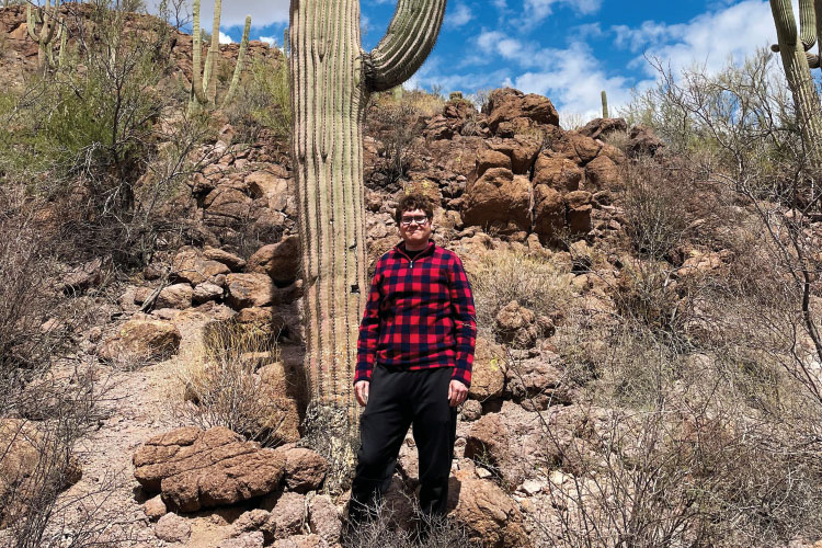 James Kowalik, Indiana Farm Bureau Insurance commercial audit representative, standing next to a cactus.