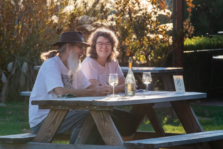 Rance and Sharon Fawbush enjoy a bottle of wine at the Owen Valley Winery outside of Spencer.