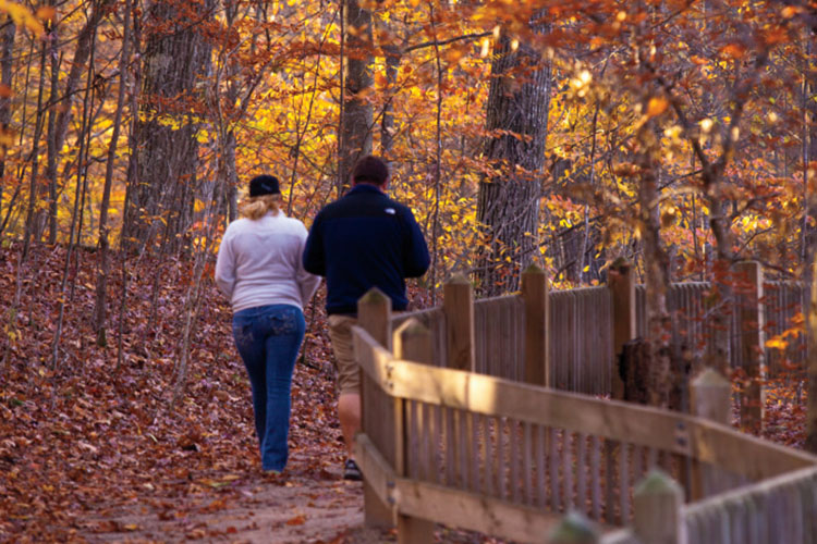 Visitors enjoy an afternoon walk on one of the many nature trails at McCormick's Creek State Park in Spencer, Indiana. 
