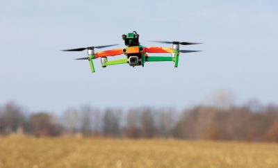 Drone flying over a field
