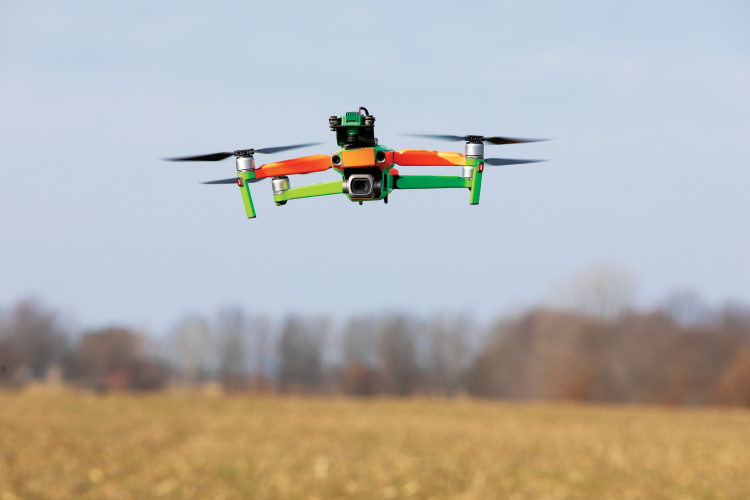 Drone flying over a field