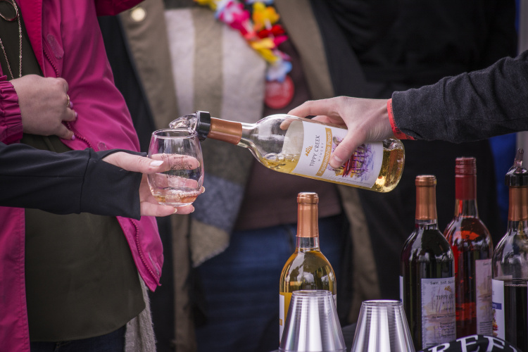 Pouring wine at the Michiana Wine Festival