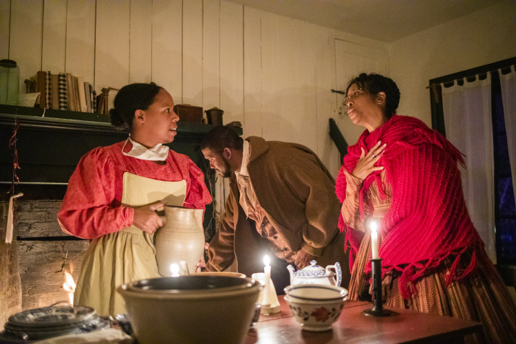 Storytellers dressed in period attire at A Merry Prairie Holiday