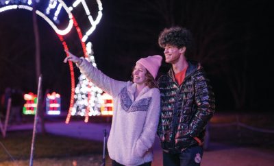 A couple admires the lights at A Merry Prairie Holiday