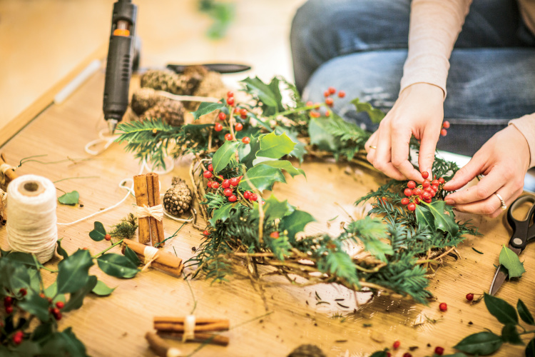 Woman preparing a Christmas wreath