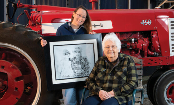 Sue Losure with her daugher Amy Beebe who is holding a photo of her dad