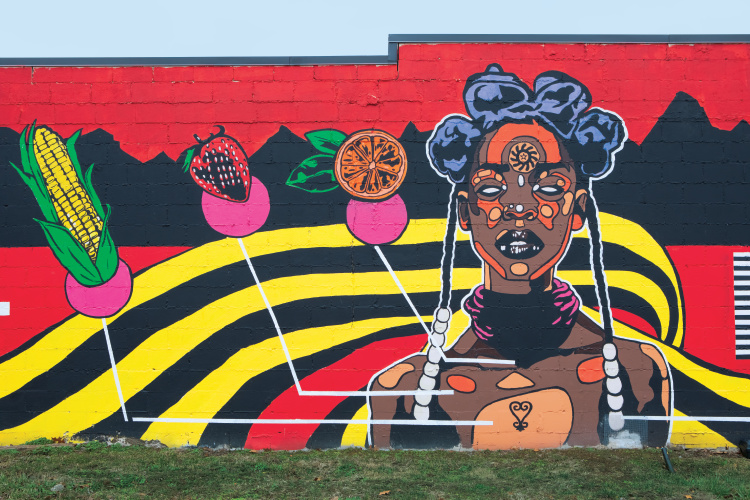 Mural on the side of Cleo's Bodega