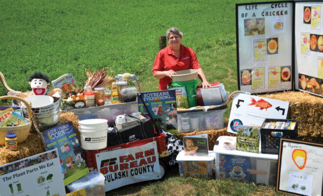 Pam Jones among some of her Ag in the Classroom teaching props