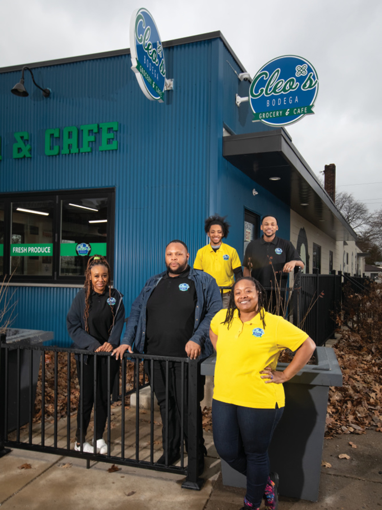 Some of Cleo's Bodega staff standing out side the business