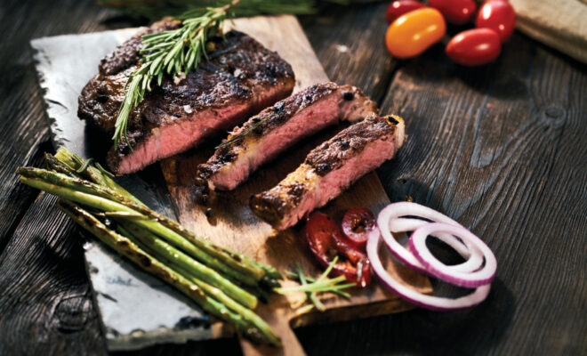 Grilled steak with herbs and vegetables