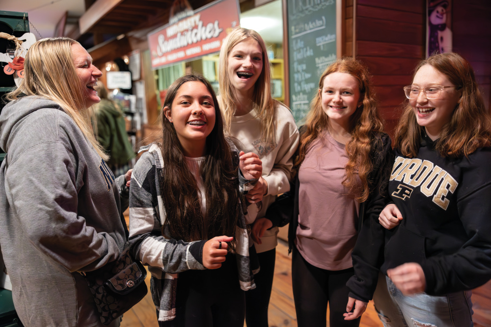 A group of teenage girls heading into one of the Piney Acres Scream Farm attractions