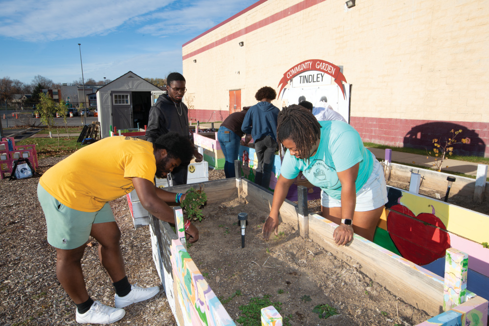 Danielle Guerin works with some of the youth in one of the gardens at Soul Food Project
