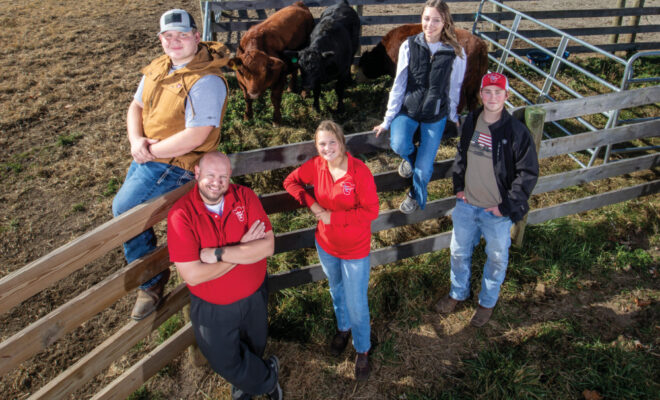 Landon Craig, Joe Dunn, Hailey Pemberton, Emilee Pickerel and Gabe Dalton standing with some of the cattle