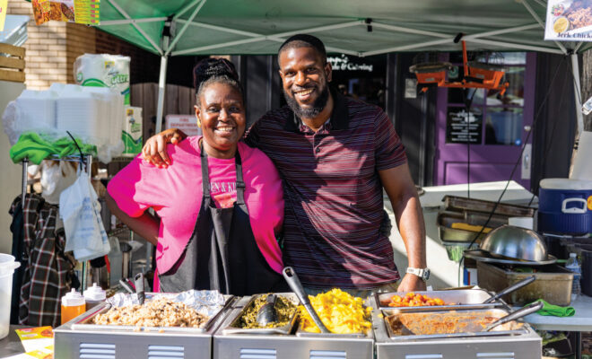 A couple at one of the food booths at the New Albany Harvest Homecoming