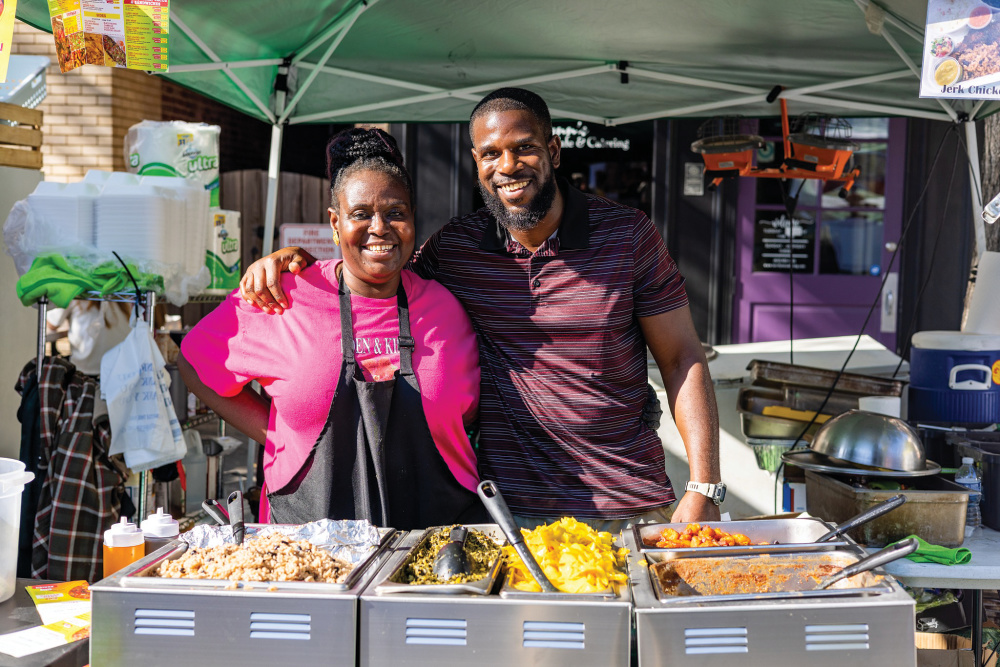 A couple at one of the food booths at the New Albany Harvest Homecoming