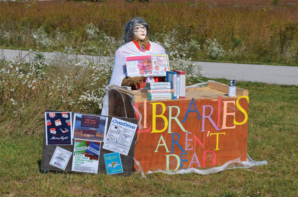 Libraries aren't dead themed scarecrow