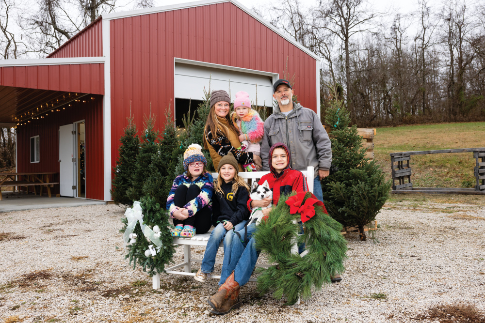 Scott and Ashley Ratkovick holding their daughter, Nellie, with their children Paisley, Nash and Brink