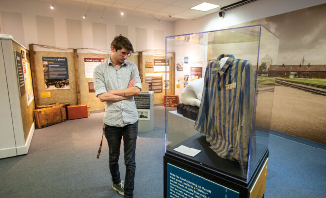Man touring the CANDLES Holocaust Museum and Education Center