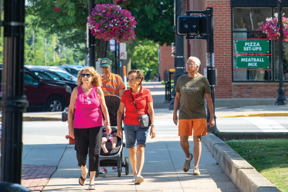 People walk through downtown Crown Point