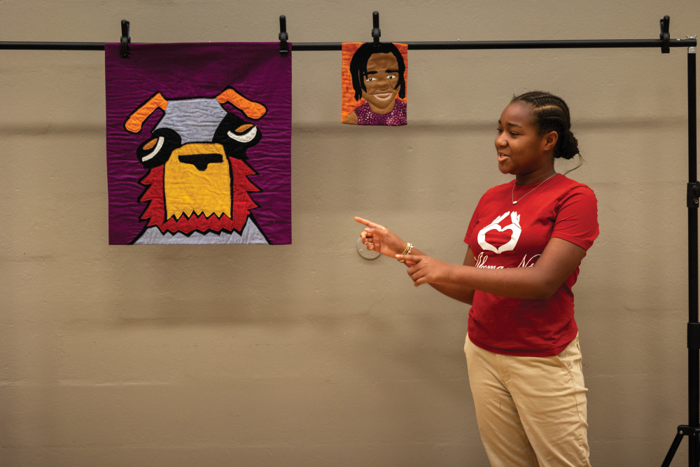 Akoma Ntoso Modern Quilt Guild member Adrianne Redd presents one of her quilt projects