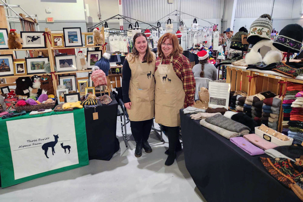 Carol Auditore with Three Furies Alpaca merchandise