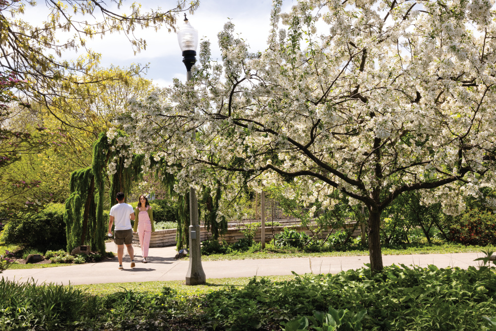 People walk through the Wellfield Botanic Gardens, one of the things to do in Elkhart