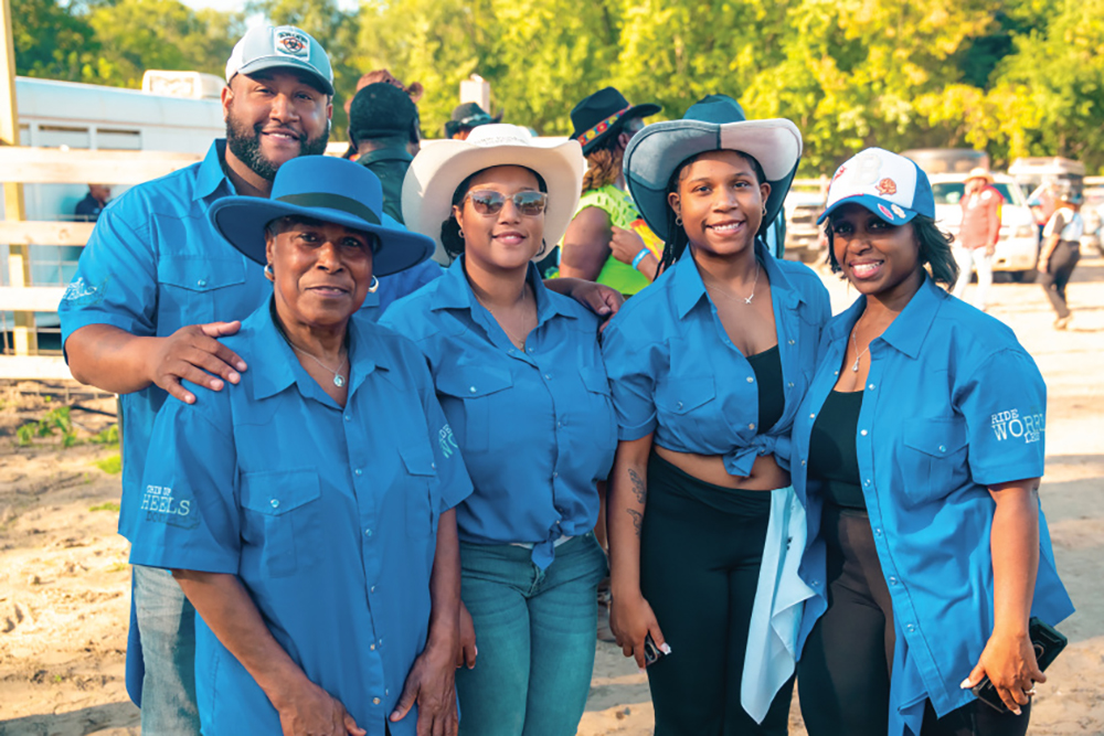 Brown family posing for a photo at the rodeo