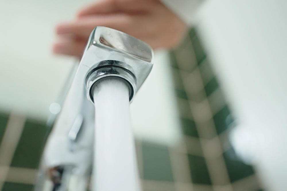 Close-up of water coming out of a faucet