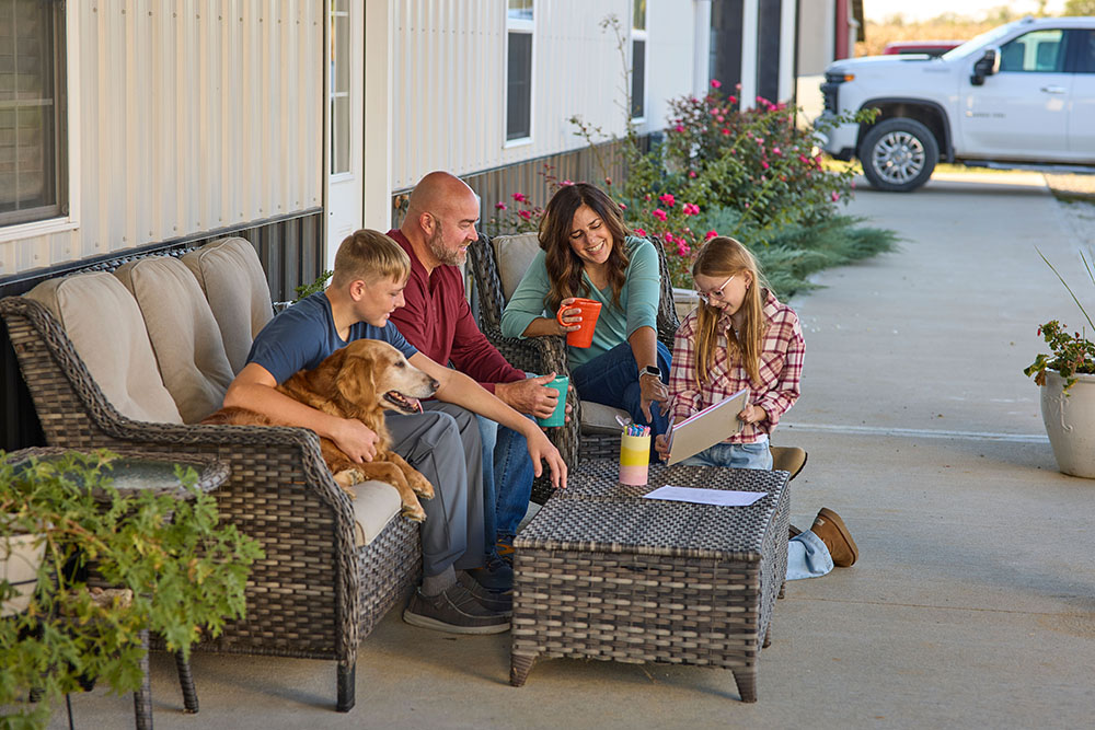 family on porch of rural property in Indiana